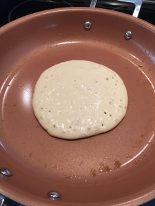 Photo of pancake in the process of cooking.