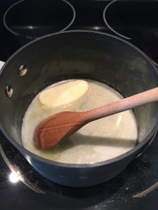 Photo of butter in saucepan.