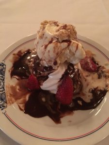 Photo of Meringue with Vanilla Ice Cream and Chocolate Sauce dessert at Antoine's Restaurant. 
