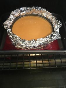 Photo of cheesecake in a water bath.