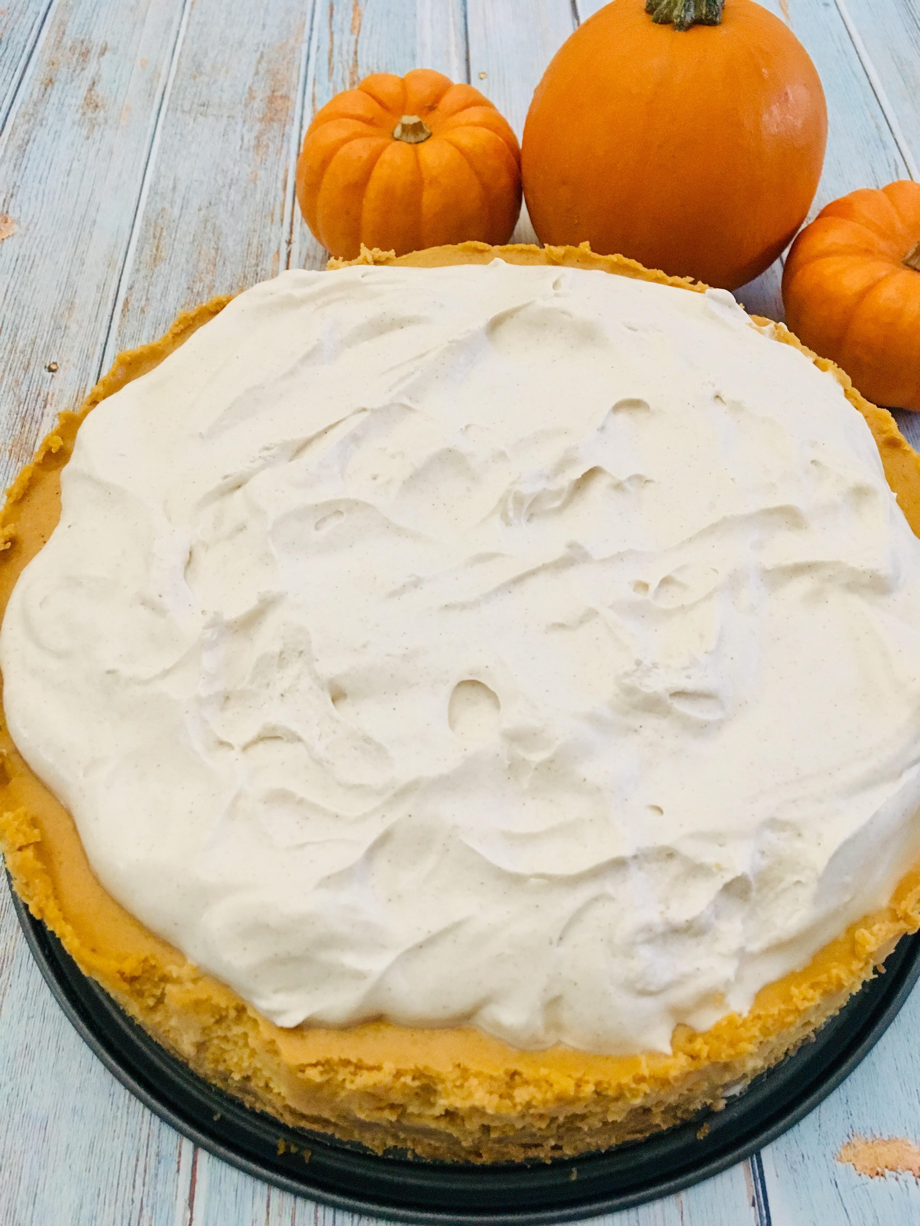 Pumpkin Cheesecake with Spiced Whipped Cream Frosting - It's Everything ...