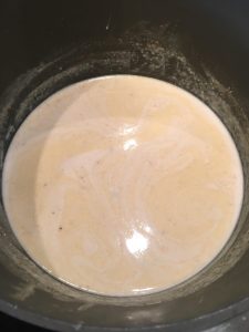 Photo of butter, cream, and spices cooking.