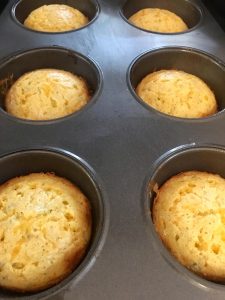 Photo of hot out of the oven Cheddar Cheese Muffins.