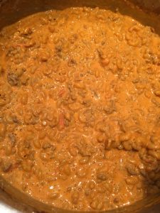 Stir macaroni into meat sauce.
