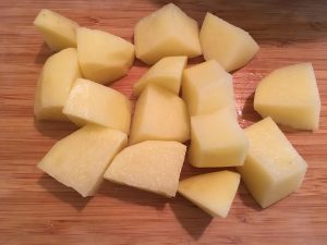 Peeled and cut Yukon Gold Potatoes.