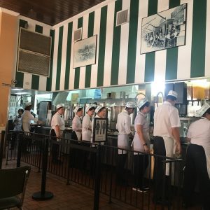 Assembly line of employees at Cafe Du Monde