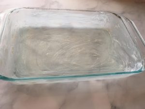 Photo of buttered 9 x 13 inch baking dish.
