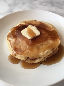 Photo of Old Fashioned Pancakes with butter and syrup.