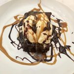 Photo of Chocolate Brownies with Vanilla Ice Cream and Caramel and Chocolate Sauce.