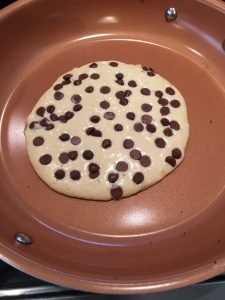 Photo of chocolate chip pancakes in the making. 