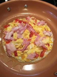Photo of egg omelette on tortilla. 