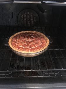 Pecan Pie with Graham Cracker Crust in the oven.