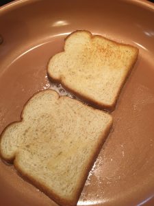 Photo of bread toasted in a pan.