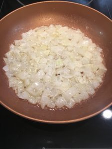 Photo of onions cooking.