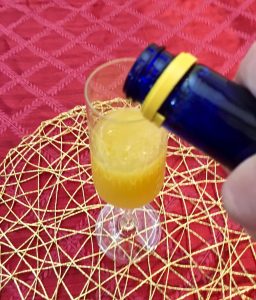 Photo of making The Orange-Pineapple Mimosa.