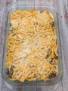 Photo of unbaked sausage and egg breakfast casserole.
