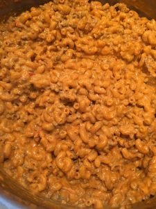 Photo of macaroni cooked in the meat sauce.