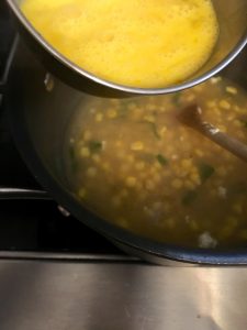 Add beaten eggs to soup.