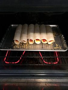 Hot dog quesadillas baking.