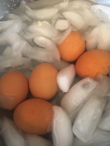 Eggs cooling in an ice water bath.