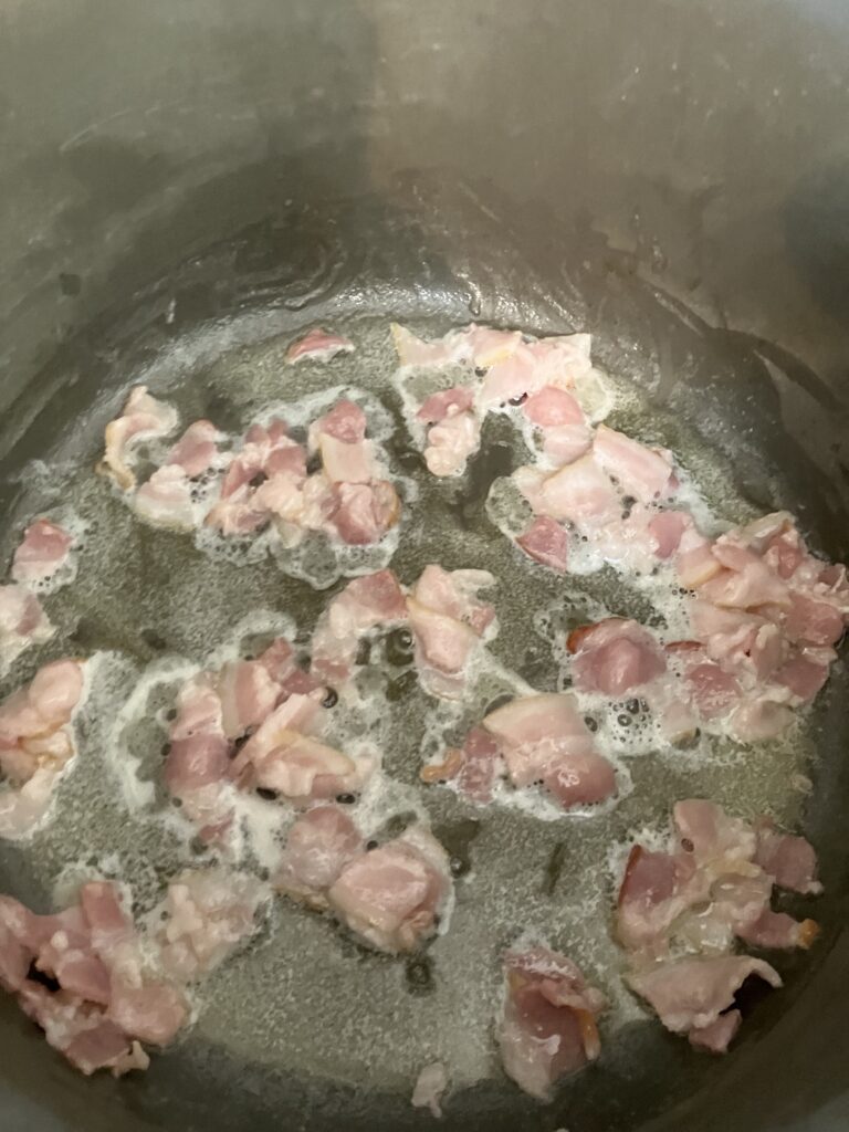 Bacon cooking in butter. 