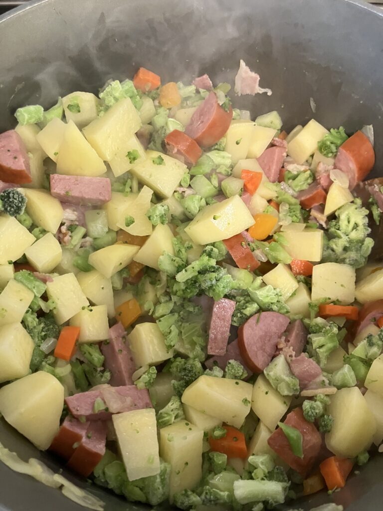Kielbasa, potatoes, broccoli, and vegetables.