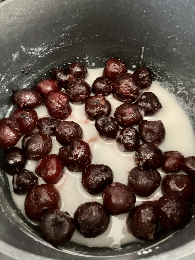 Add frozen cherries to corn starch mixture.