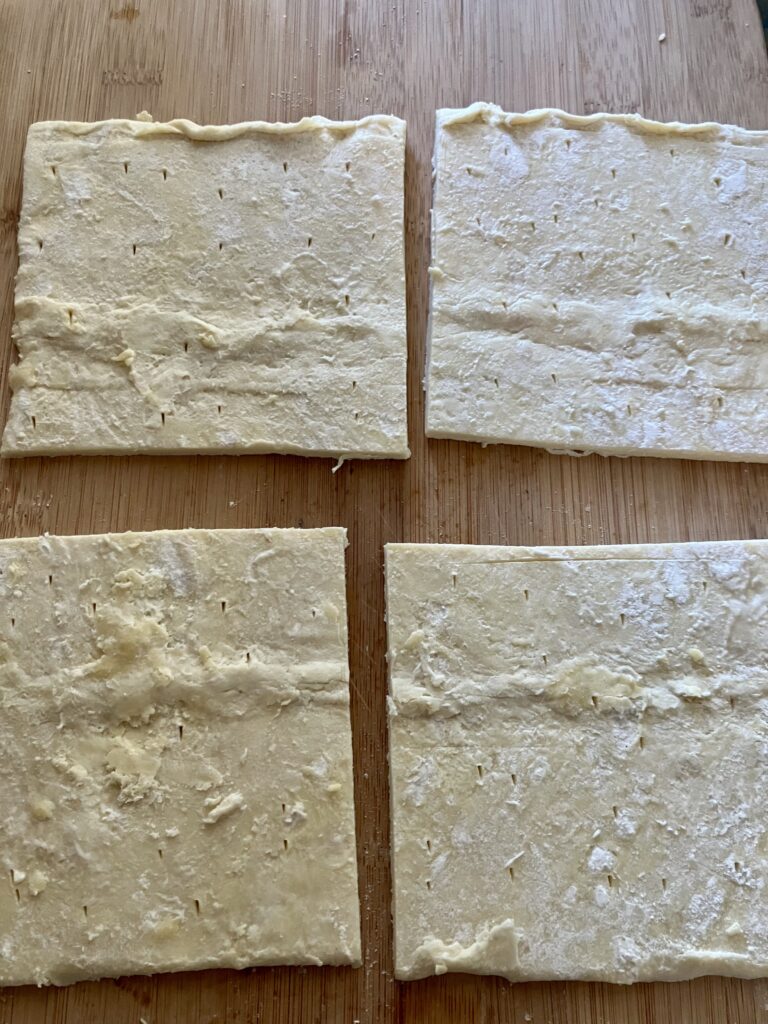 Puff pastry sheet cut into squares. 