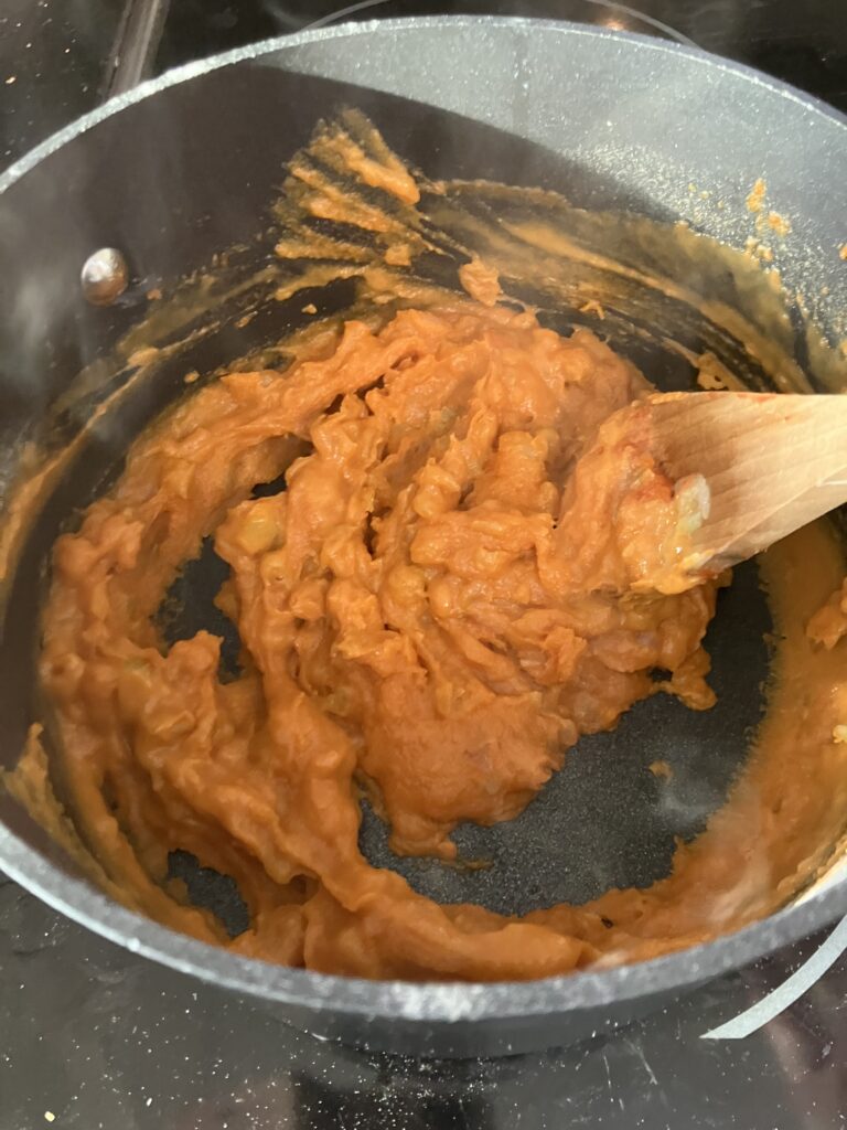 Add flour to tomato paste and vegetables. 