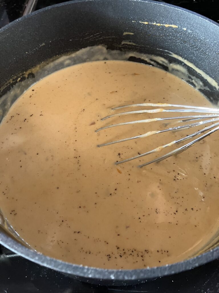 Add half and half and cream to the soup base. 