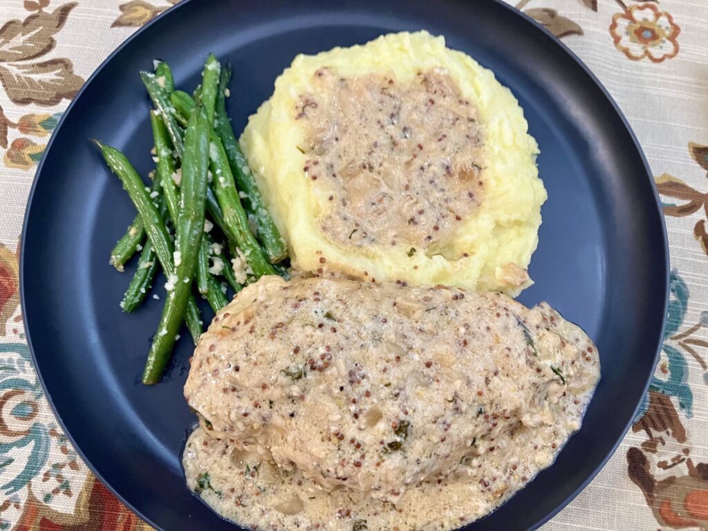 Chicken Dijon with mashed potatoes and haricot verts (green beans). 