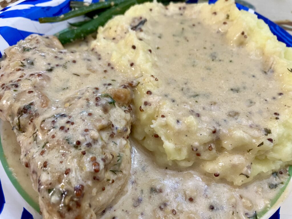 Chicken Dijon with mashed potatoes and haricot verts (green beans). 
