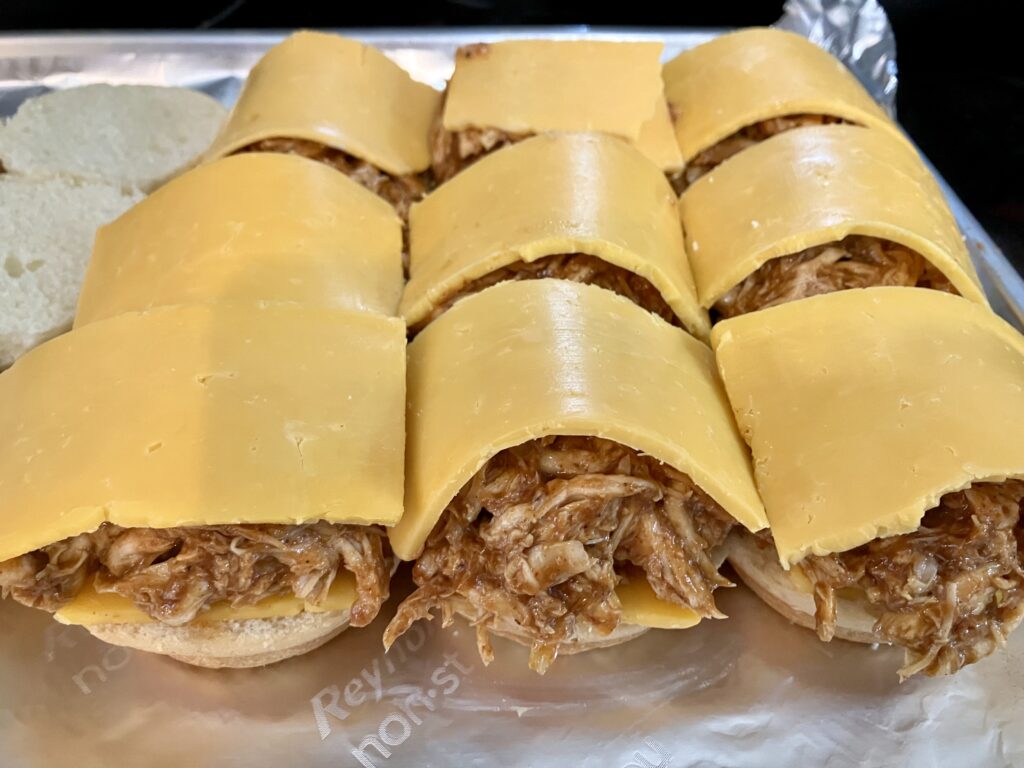 Add more cheese to the bbq chicken rolls. 