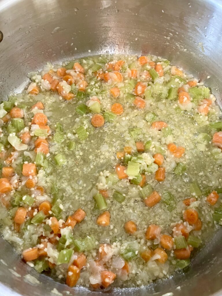 Celery, onions, carrots, and garlic cooking. 