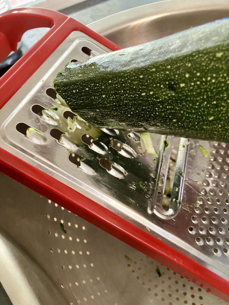 Grate zucchini. 