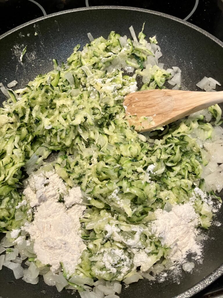 Add flour to zucchini mixture. 