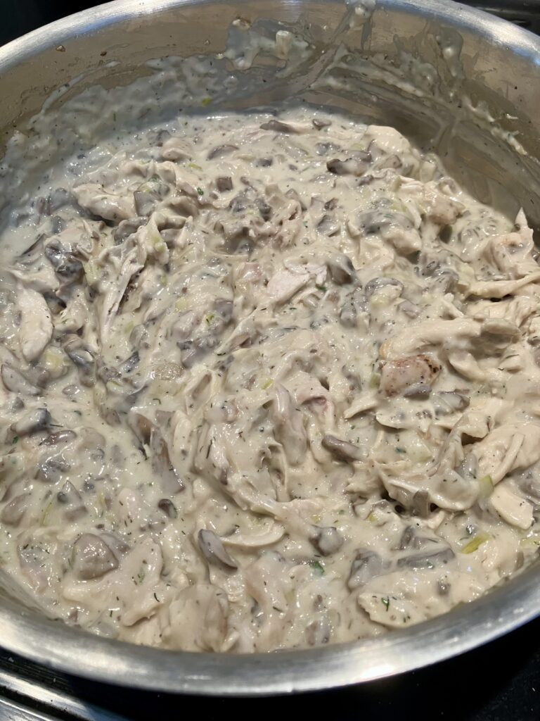 Chicken and creamy mushroom mixture for pot pie.