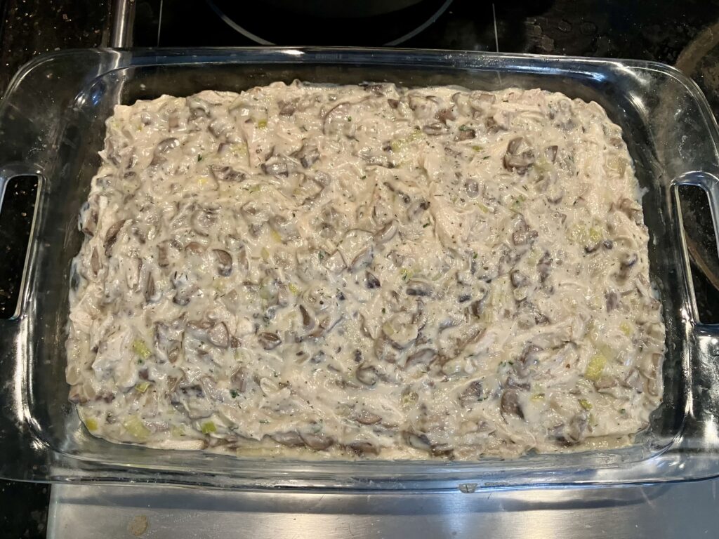 Pour the chicken and vegetable mixture into the 9 x 13 inch baking dish.