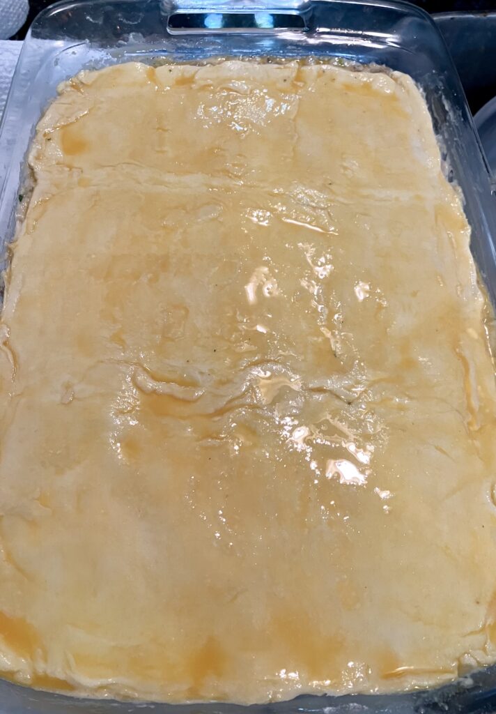 Raw puff pastry with egg wash.