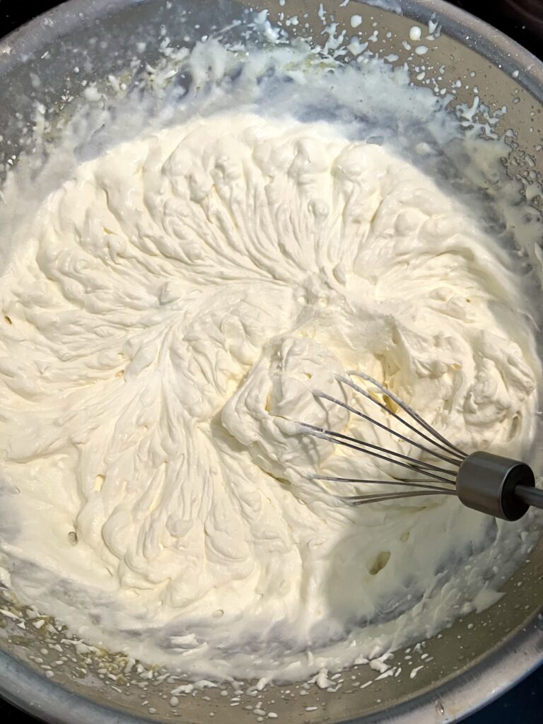 Whipped heavy cream with powdered sugar. 