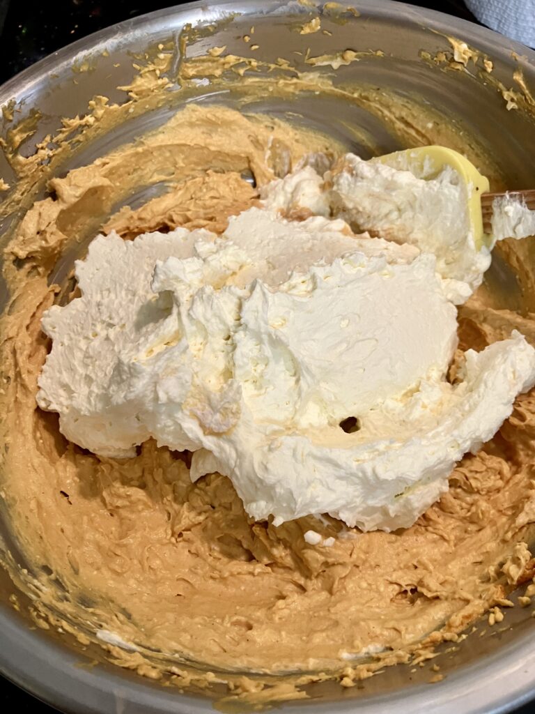 Stir heavy whipped cream into pumpkin mixture. 