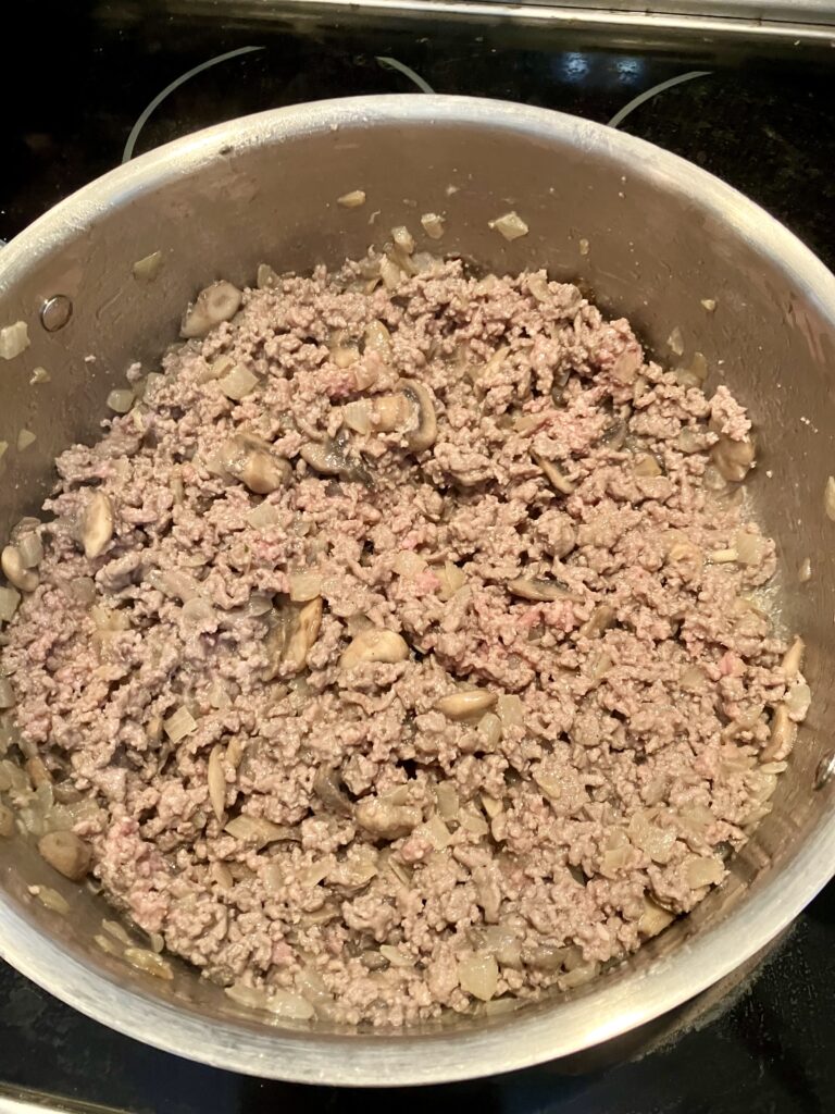 Cooked ground beef for sauce. 