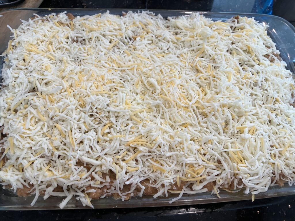 Layer six: more cheese. 