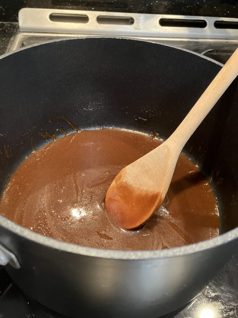 In a pan, melt the butter on low-medium heat.  Add the brown sugar and corn syrup.  Stir until melted.