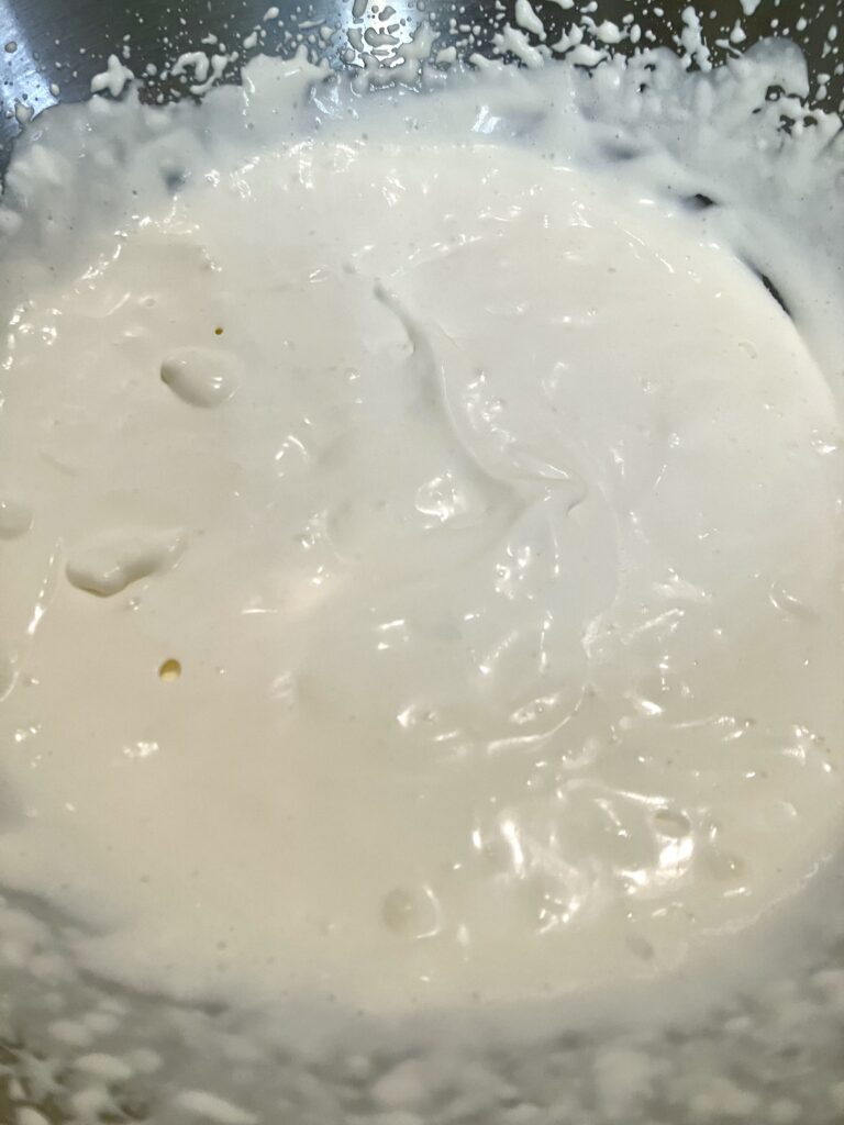 Whipped cream beaten to soft peaks. 