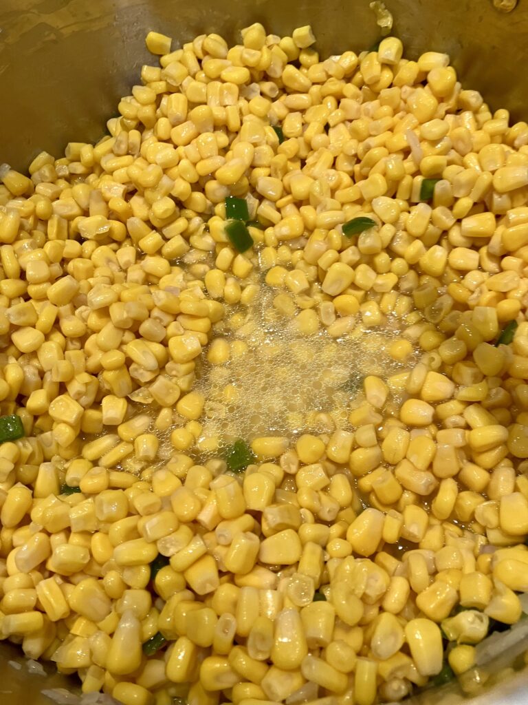 Corn cooking in a pot. 