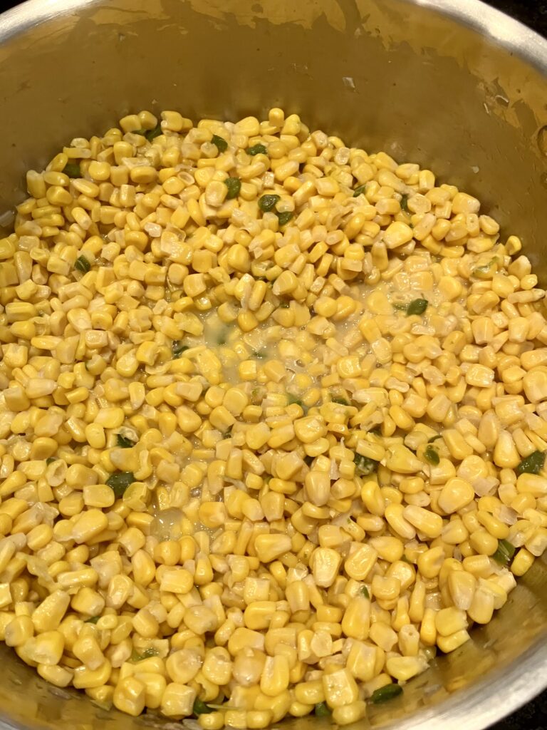 Corn cooking in a pot for 30 minutes. 