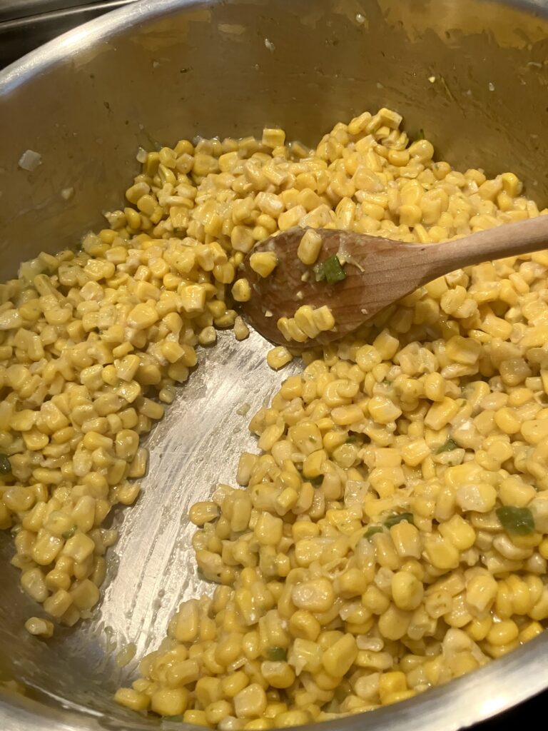 Cooked corn with corn starch added to thicken it. 