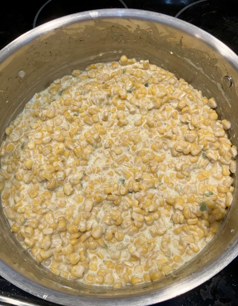 Cream added to jalapeno corn. 