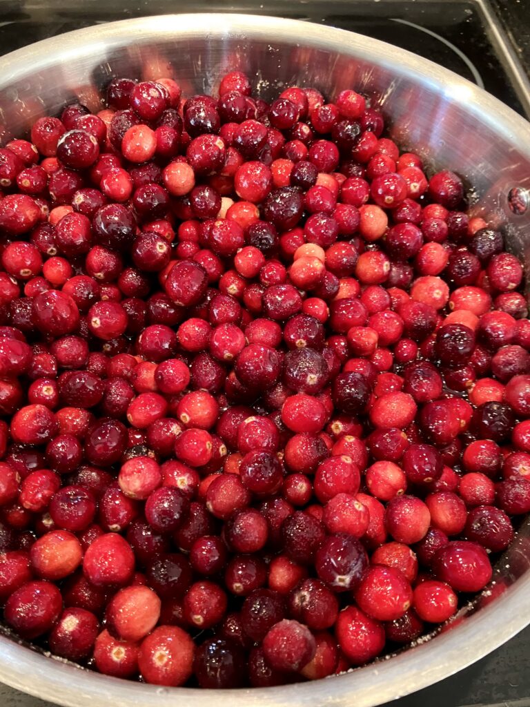 Fresh whole cranberries combined with cranberry juice, orange juice, sugar, Grand Marnier, Cointreau, Vanilla extract, and ground cinnamon. 